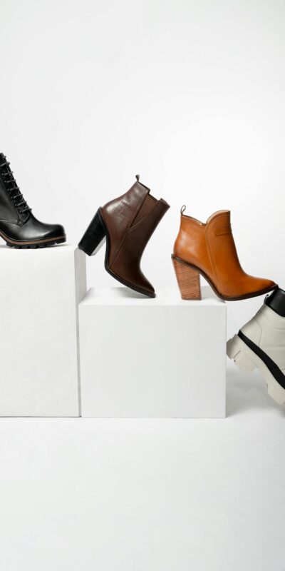 Elegant collection of women's leather boots showcasing variety in style and color.