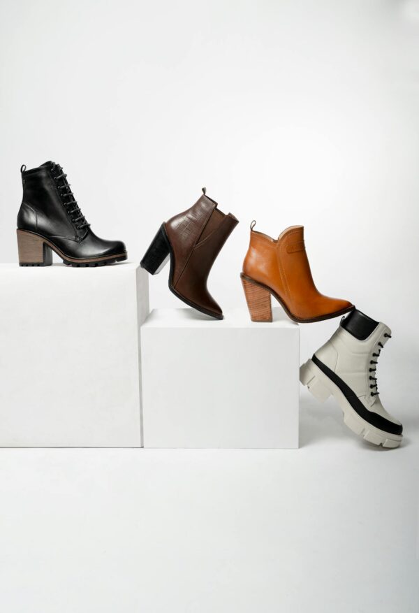 Elegant collection of women's leather boots showcasing variety in style and color.